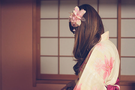 geisha with long curl hair and flower hair piece thumbnail