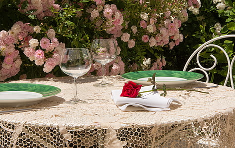 red rose on top of white table napkin thumbnail