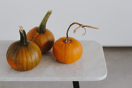 Orange halloween pumpkins on marble thumbnail