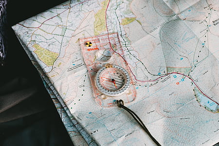 white compass on political map thumbnail