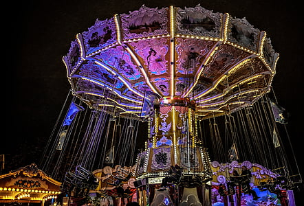 swing carnival ride with lights turned-on thumbnail