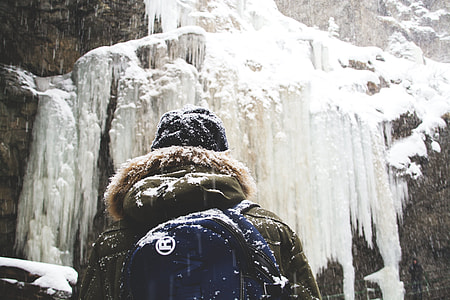 person in front of snow covered mountain thumbnail