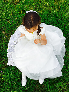 girl sitting on green grass thumbnail
