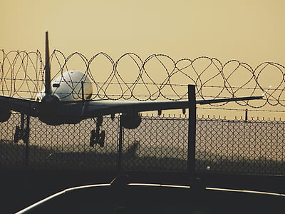 low light photography of airplane during daytime thumbnail