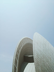 white concrete building under gray sky at daytime thumbnail