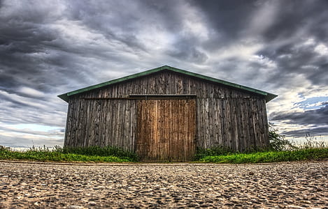 wooden shed and cloudy sky thumbnail