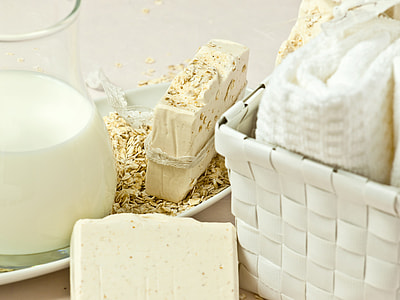 milk glass and cheese beside white basket thumbnail