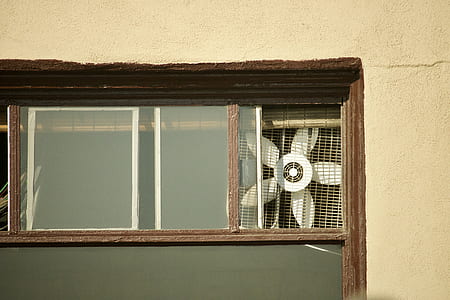white fan attached on window thumbnail