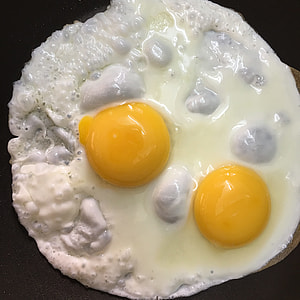 fried egg on black surface thumbnail