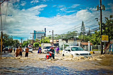 suburban street submerge in water during daytime thumbnail