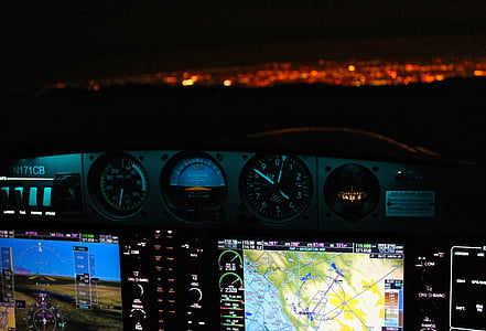 airplane digital and analog panels at night thumbnail