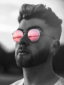 man wearing pink lens sunglasses thumbnail