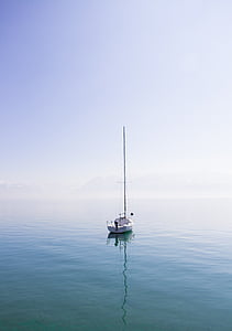 white boat floating on body of water thumbnail