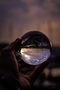 Person Holding Glass Ball thumbnail