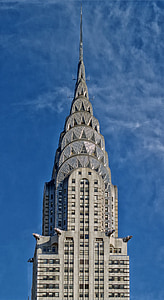gray concrete tower building under blue sky thumbnail