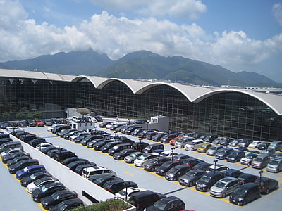 vehicle lot on parking lot near building during daytime thumbnail