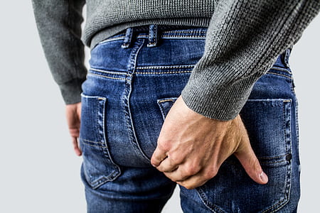 person holding back pocket thumbnail