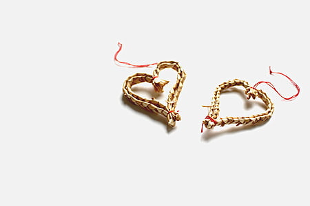 pair of brown heart decors on white surface thumbnail