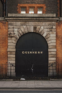 closed black wooden Guiness door thumbnail