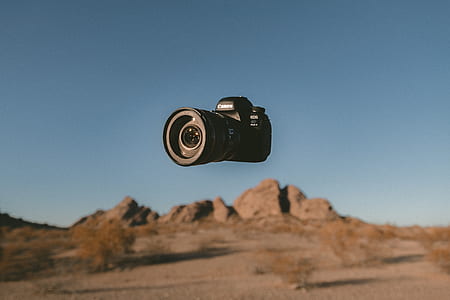 black DSLR camera thumbnail