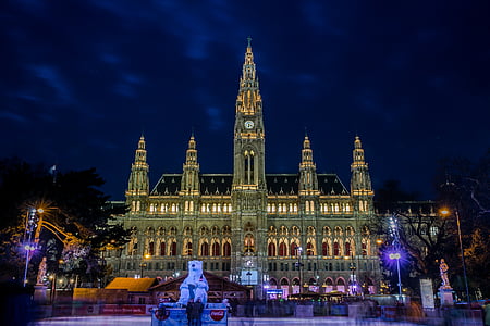 gray lighted church beside fountain thumbnail