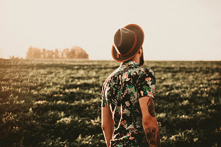man facing green plant fields thumbnail