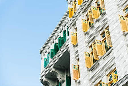 photo of white and yellow concrete building thumbnail