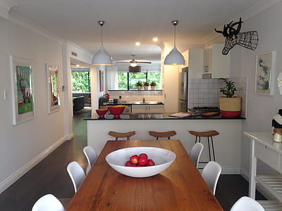 red apples on bowl displayed on table thumbnail