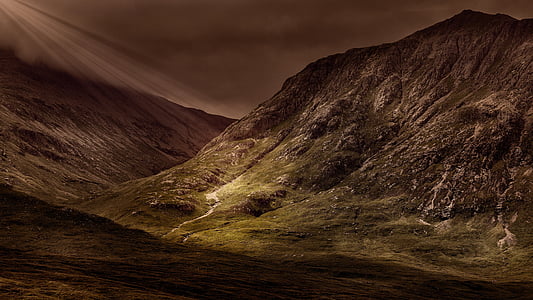brown and green rock formation during night time thumbnail
