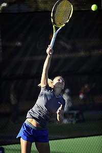 woman going hit tennis ball on mid-air thumbnail