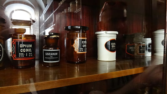 jars on brown wooden shelf thumbnail
