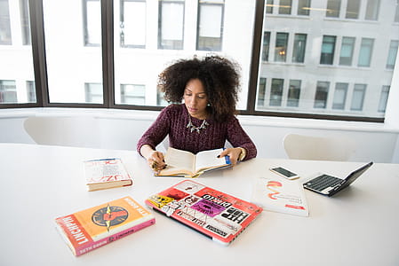 person, woman, books, desk thumbnail