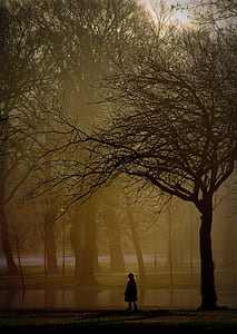 Brown Photo of Girl Standing Near Tree thumbnail