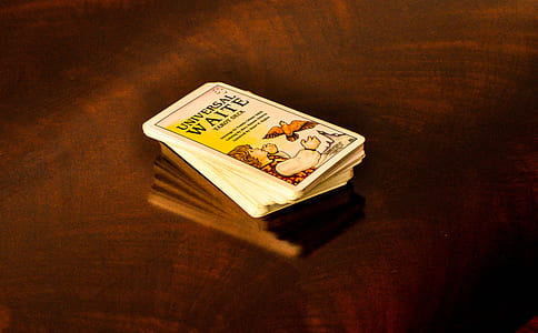 white cards on top of brown wooden table thumbnail