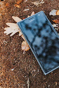 Black mobile phone on the ground thumbnail