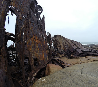 ship wreck on The seashore during day time thumbnail
