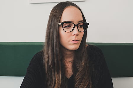 woman wearing eyeglasses looking on her left side thumbnail