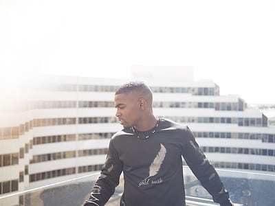 man in black long-sleeved top thumbnail