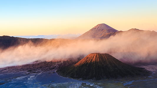 mountain ranges covered in white fog thumbnail