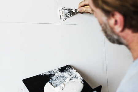 Man Holding Black Board With White Paint, Painting Wall thumbnail