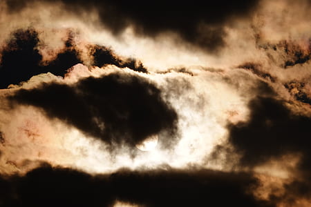 low angle photography of sun covered clouds thumbnail
