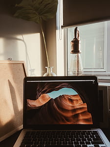 MacBook Pro on desk near window thumbnail