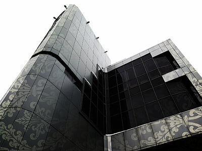black glass building under white sky thumbnail