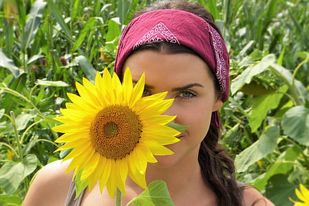 female holding sunflower thumbnail
