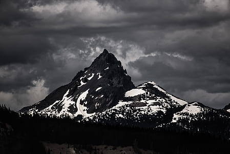 silhouette of trees with mountains during night time thumbnail