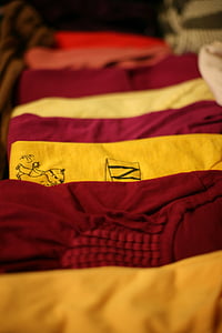 several assorted-color shirts on brown surface thumbnail