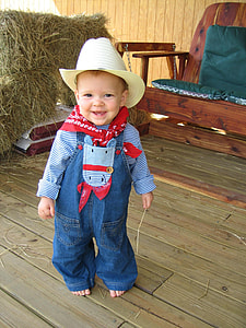 closeup photo of toddler in blue denim jumper pants thumbnail