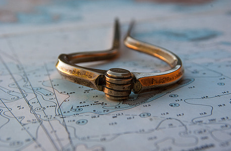 gold-colored metal tool in closeup photography thumbnail