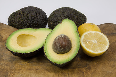 sliced avocado beside sliced yellow citrus thumbnail
