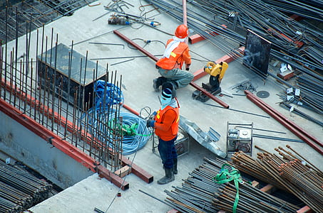 man standing near gray metal rod lot at daytime thumbnail